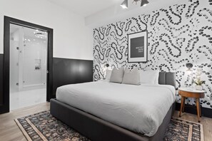 Retreat to the primary bedroom with a plush king bed, walk-in closet, blackout shades, and a smart TV. Designed for comfort and privacy, this suite is perfect for recharging after a day exploring New Orleans.