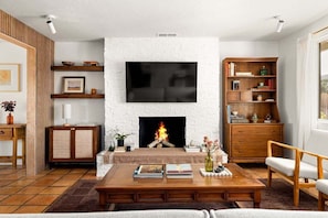 Living room includes a large TV. Log into your streaming services and catch up on your favorite shows! P.S. Indoor Fireplace is not allowed - DO NOT USE