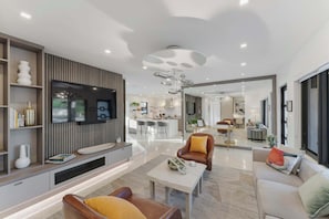 Designed for both relaxation and entertainment, this spacious living room combines luxury with modern elegance