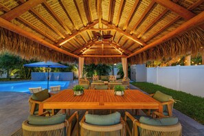 Set the scene for unforgettable evenings with outdoor dining under the tiki hut—where good food and great company meet.