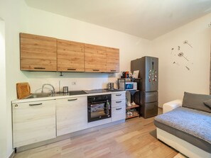 Cabinetry, Furniture, Countertop, Building, Kitchen Sink, Sink, Kitchen Appliance, Wood, Kitchen Stove, Home Appliance