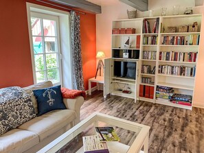 Furniture, Property, Couch, Bookcase, Table, Interior Design, Lighting, Wood, Living Room, Shelf