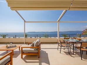 Sky, Water, Furniture, Building, Azure, Table, Shade, Outdoor Furniture, Chair, Seaside Resort