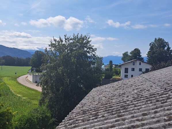Sky, Cloud, Property, Building, Plant, Tree, Slope, House, Vegetation, Landscape