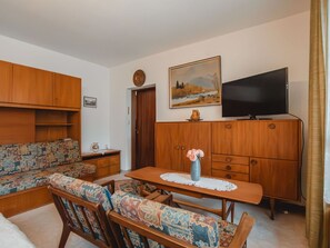 Furniture, Interior Design, Flooring, Wood, Floor, Room, Lighting, Picture Frame, Living Room, Cabinetry