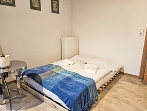 Furniture, Floor, Flooring, Wood, Interior Design, Bedroom, Linens, Textile, Bed, Room