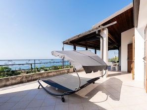 Sky, Property, Furniture, Table, Azure, Chair, Building, Window, Shade, Architecture