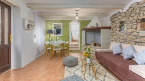 The living room and dining area of Casa Dvi Mendule