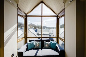 Sofa in the large window in the loft sitting room