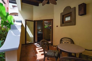 Porch opens onto the courtyard and fountan
