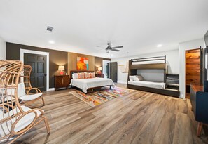 Spacious and stylish, the primary bedroom offers a king-sized bed and a serene atmosphere for a restful night’s sleep.