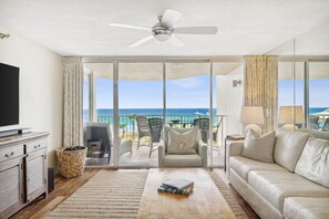 Living Room features a large leather sectional for your whole group, a 65" Smart TV, and stunning Gulf Views!