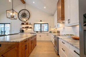 Stunning kitchen with large granite island.