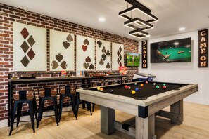 A sleek game room featuring a pool table, perfect for entertaining.