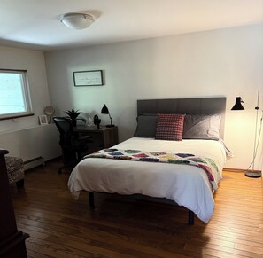 Queen-size bed, full-size closet, chest of drawers, comfy bench, egress window.