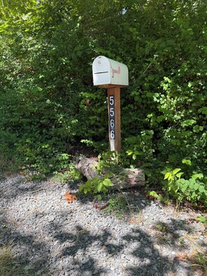 Go to the very end of the road. Look for the mailbox, turn left up the driveway.