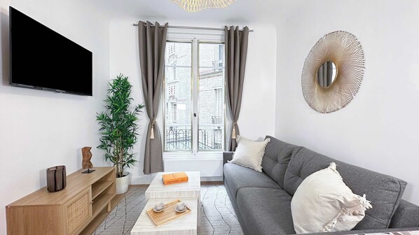 Living room with double sofa bed, flat screen TV and free Wi-Fi