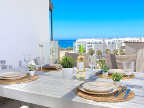 Tableware, Table, Furniture, Sky, Building, Dishware, Azure, Outdoor Furniture, Interior Design, Tablecloth