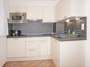 Countertop, Cabinetry, Property, Sink, Building, Kitchen Appliance, Kitchen Sink, Tap, Kitchen, Kitchen Stove