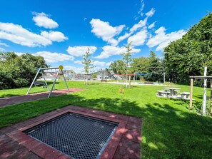 Grass, Outdoor Play Equipment, Public Space, Playground Slide, Park, Garden, Playground, Chute, Lawn, Artificial Turf