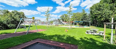 Grass, Outdoor Play Equipment, Public Space, Playground Slide, Park, Garden, Playground, Chute, Lawn, Artificial Turf