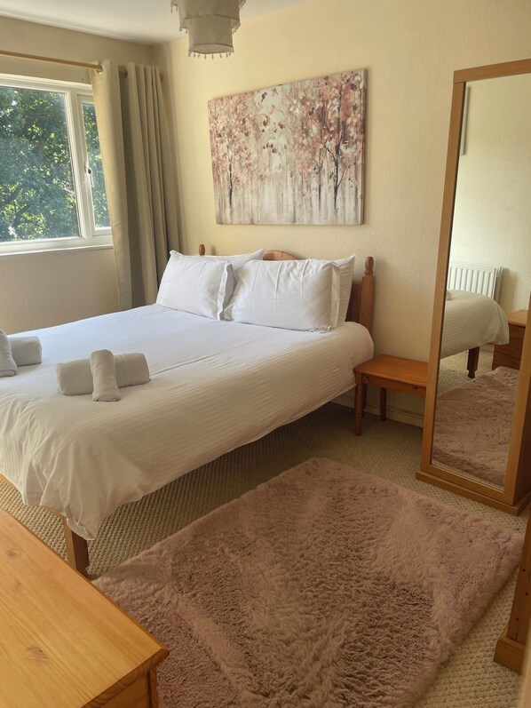 Main bedroom with king bed and fitted wardrobes