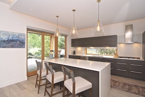 Kitchen over sized island with 3 bar stools