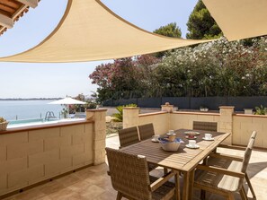 Property, Sky, Table, Furniture, Water, Shade, Lighting, Wood, Outdoor Furniture, Interior Design