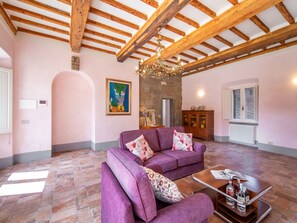 Couch, Property, Furniture, Purple, Wood, Interior Design, Building, Lighting, Living Room, Flooring