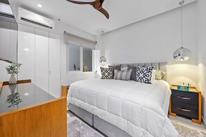 The bedroom invites you to relax in a glorious king bed