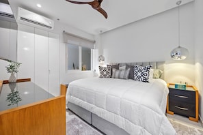 The bedroom invites you to relax in a glorious king bed