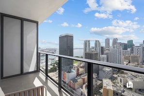 Open the floor-to-ceiling glass doors and step out onto your private balcony