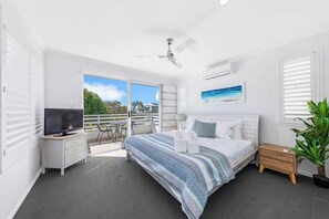 The lovely master bedroom with a king bed, AC, ensuite and balcony.