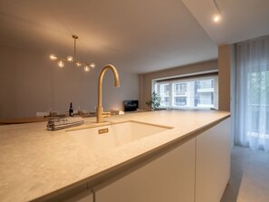 Tap, Sink, Plumbing Fixture, Cabinetry, Countertop, Window, Kitchen Sink, Wood, Kitchen, Interior Design
