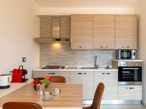 Furniture, Cabinetry, Countertop, Kitchen Stove, Wood, Kitchen, Lighting, Building, Interior Design, Flooring