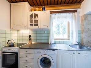 Cabinetry, Kitchen Sink, Property, Laundry Room, Countertop, Kitchen Stove, Building, Kitchen, Sink, Tap