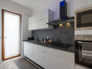 Cabinetry, Countertop, Building, Kitchen Stove, Window, Interior Design, Wood, Sink, Tap, Kitchen