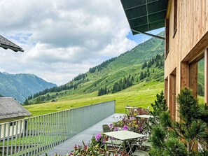 Cloud, Plant, Sky, Property, Flower, Green, Mountain, Natural Landscape, Building, Architecture