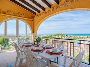 Sky, Table, Property, Furniture, Building, Plant, Chair, Window, Outdoor Table, Tableware