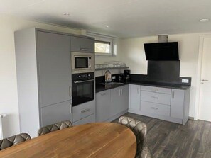 Cabinetry, Property, Furniture, Countertop, Kitchen Stove, Wood, Kitchen Appliance, Kitchen, Interior Design, Flooring