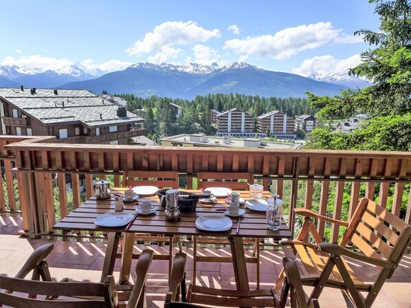 Sky, Cloud, Furniture, Table, Property, Building, Mountain, Wood, Tree, Outdoor Furniture