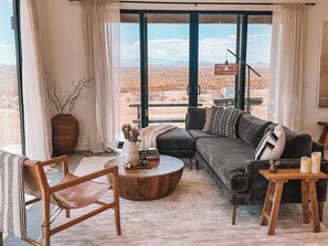 Living room filled with natural light and panoramic views