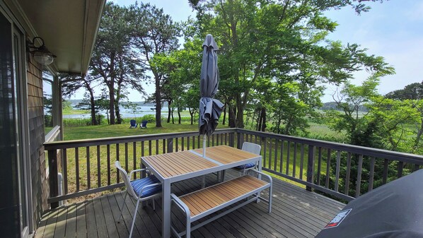 Lovely deck with table and gas grill