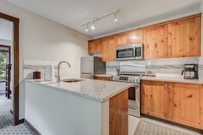 Fully equipped kitchen with modern appliances and plenty of counter space.