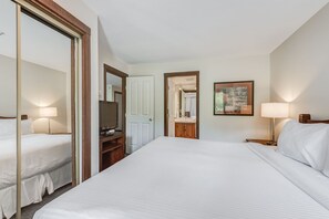 Comfortable bedroom with a cozy large bed.