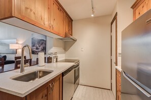 Functional area with all the essentials for preparing meals and plenty of counter space.