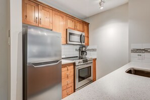 Fully equipped kitchen with modern appliances and ample counter space.