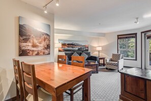Spacious dining area with plenty of seating, perfect for meals or gatherings.