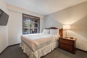 Bright bedroom with a comfortable bed and soft lighting for relaxation.