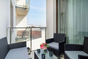 Cozy, furnished balcony.
